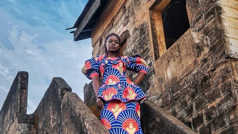 A Ghanaian woman in an African print dress