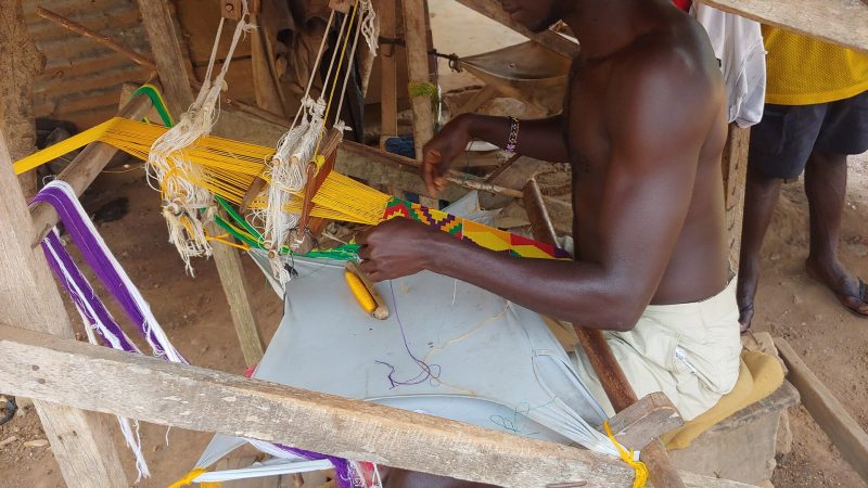 A weaver making kente cloth in Bonwire, Ashanti Region