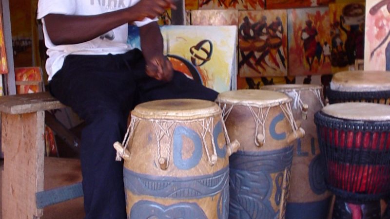 Drummer Daladi Eliyasu playing kpanlogo drums