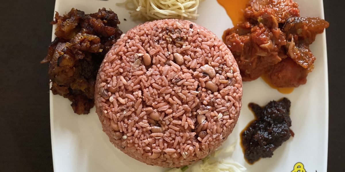 Waakye served with kelewele, spaghetti, salad, stew and shito